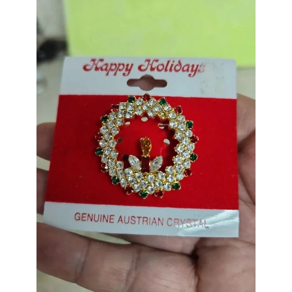 holiday wreath and candle with lots of crystals brooch